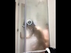 Horny Latina fucking in hotel shower